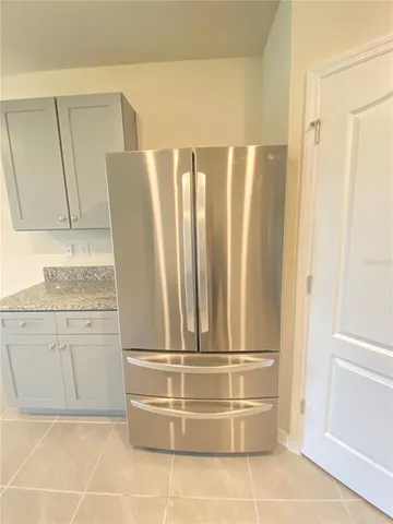 a kitchen with a refrigerator