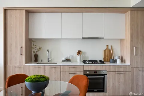 a kitchen with a table and chairs
