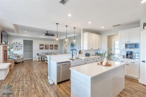 a kitchen with a sink counter top space and appliances