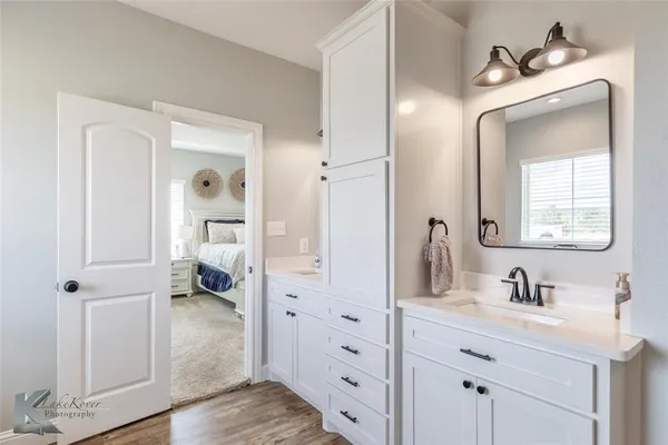 a en suite bathroom with a toilet sink and mirror