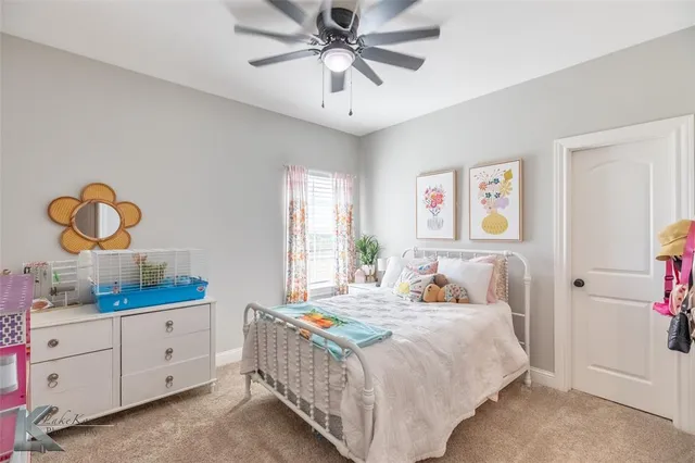 a bathroom with double vanity sinks and a mirror
