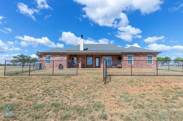 a view of a lake with a yard