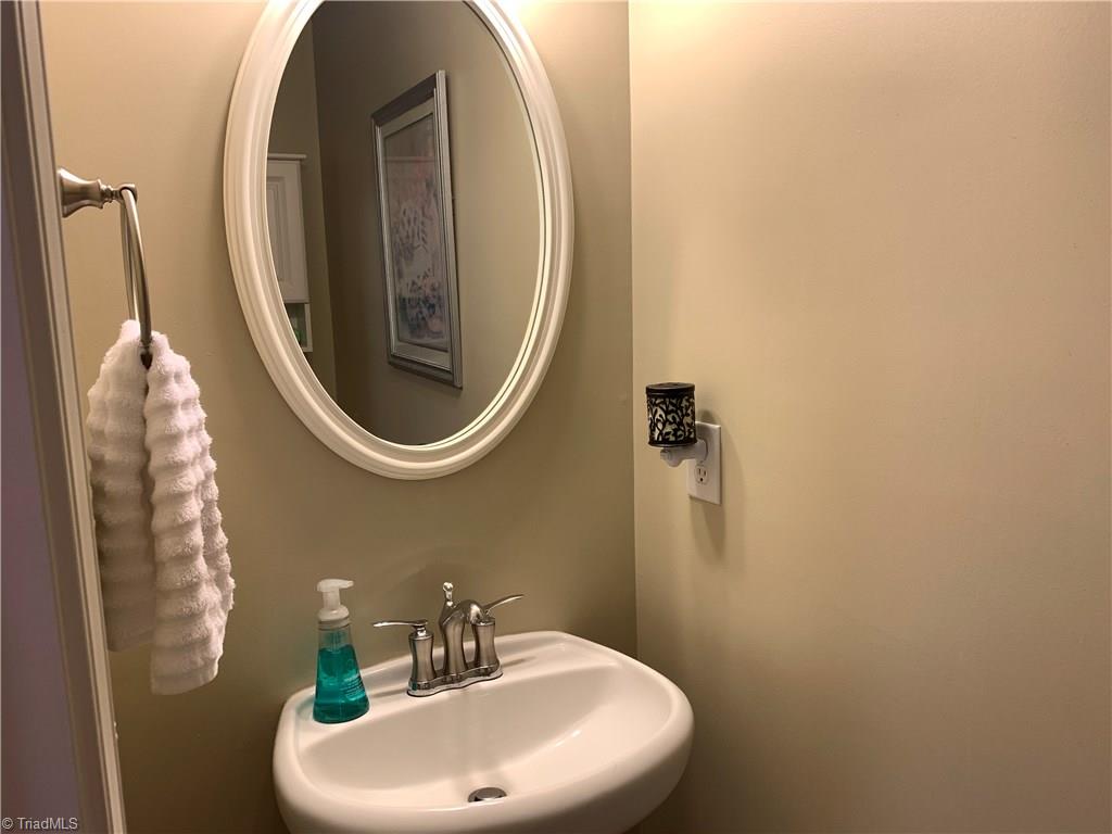 1124 Wesson Court High Point, NC 27265 - Photo 15 of 30 Main floor half-bath with pedestal sink