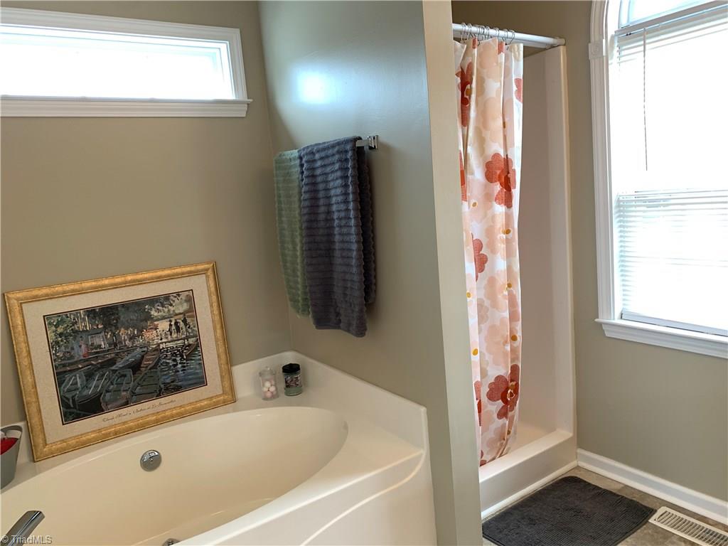 1124 Wesson Court High Point, NC 27265 - Photo 20 of 30 Soaking tub, separate shower and so much natural light in the master bath