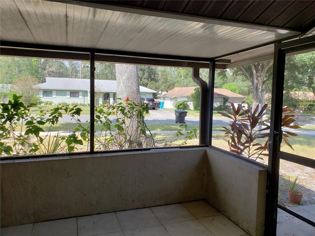 4876 Lake Ridge Road, Unit 5 Orlando, FL 32808 - Photo 10 of 11 a view of a glass door with a balcony