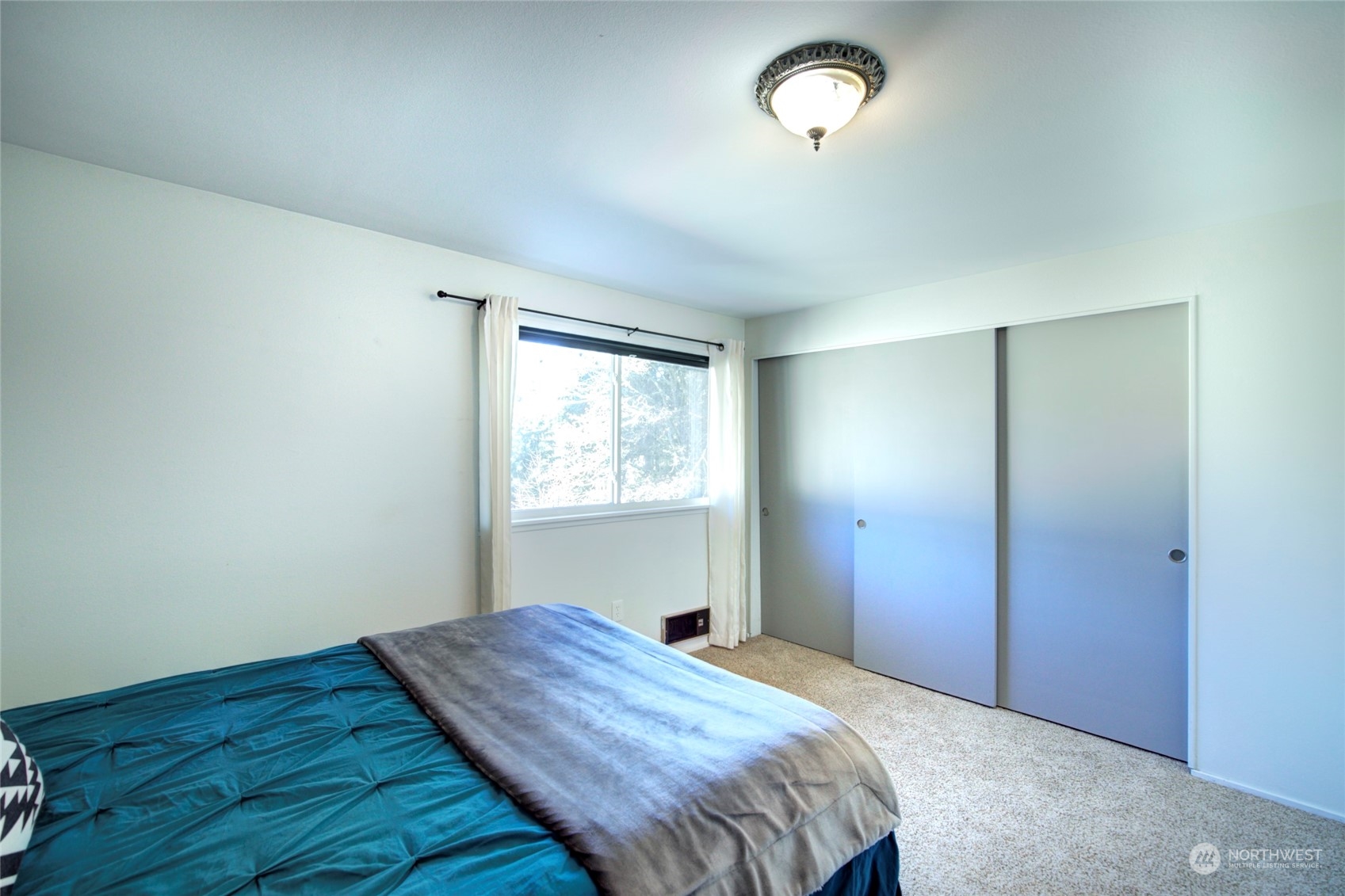 22906 Edmonds Way, Unit 15 Edmonds, WA 98020 - Photo 16 of 22 a bedroom with bed and window