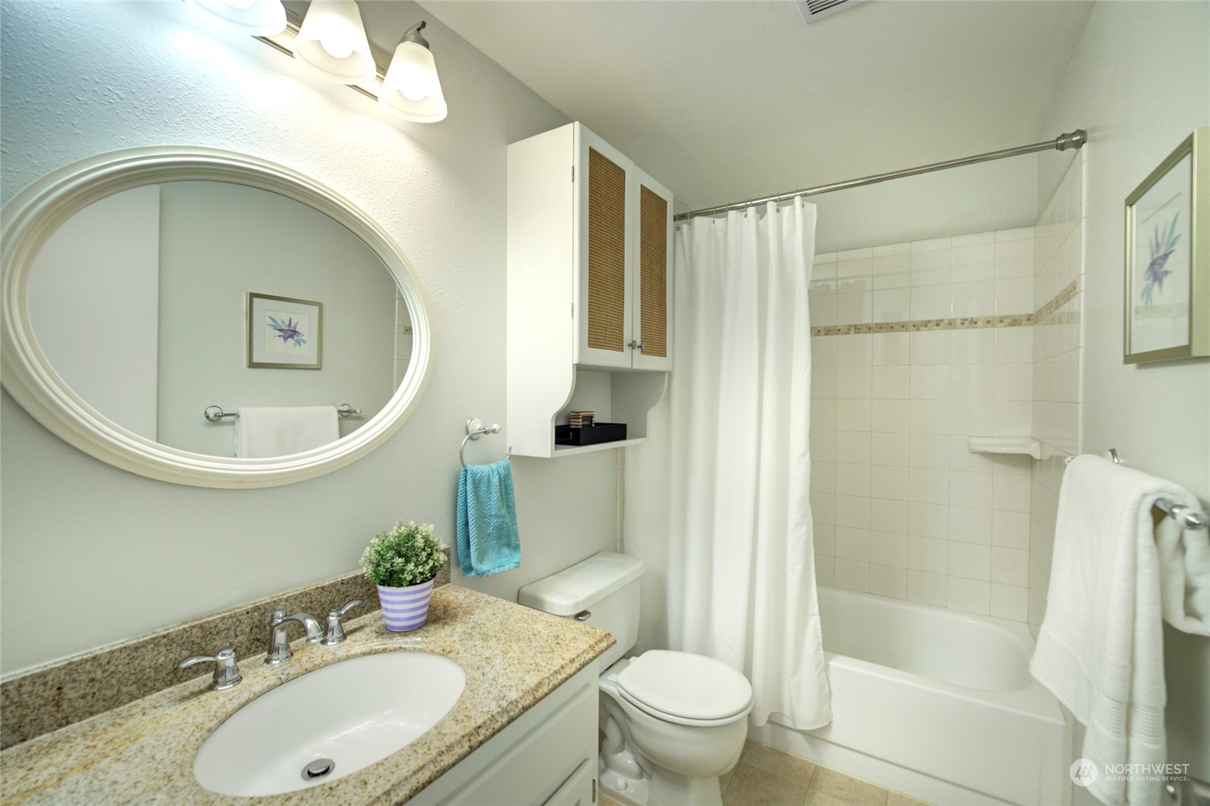 22906 Edmonds Way, Unit 15 Edmonds, WA 98020 - Photo 17 of 22 a bathroom with a sink a toilet and shower