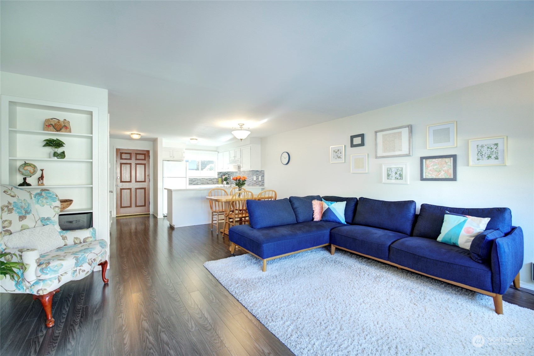 22906 Edmonds Way, Unit 15 Edmonds, WA 98020 - Photo 3 of 22 a living room with furniture and wooden floor