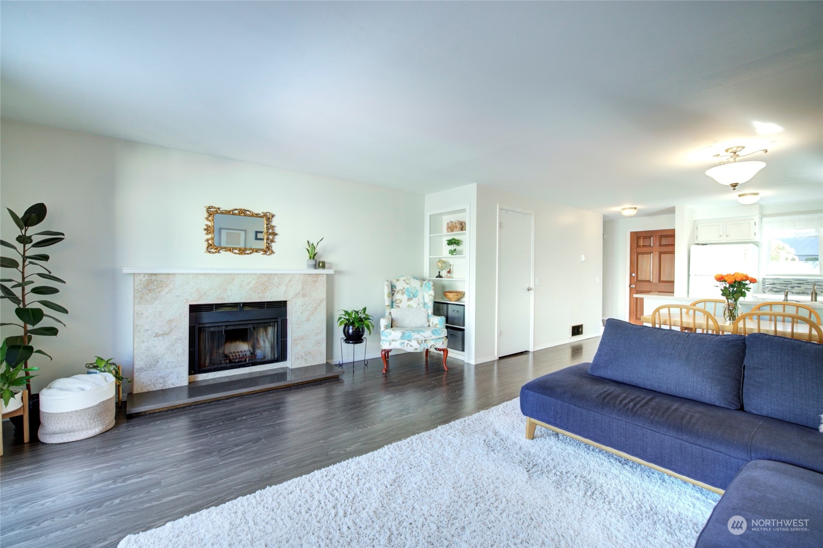 22906 Edmonds Way, Unit 15 Edmonds, WA 98020 - Photo 5 of 22 a living room with furniture and a fireplace