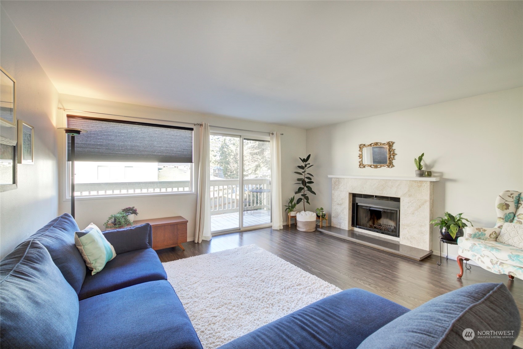 22906 Edmonds Way, Unit 15 Edmonds, WA 98020 - Photo 6 of 22 a living room with furniture and a fireplace