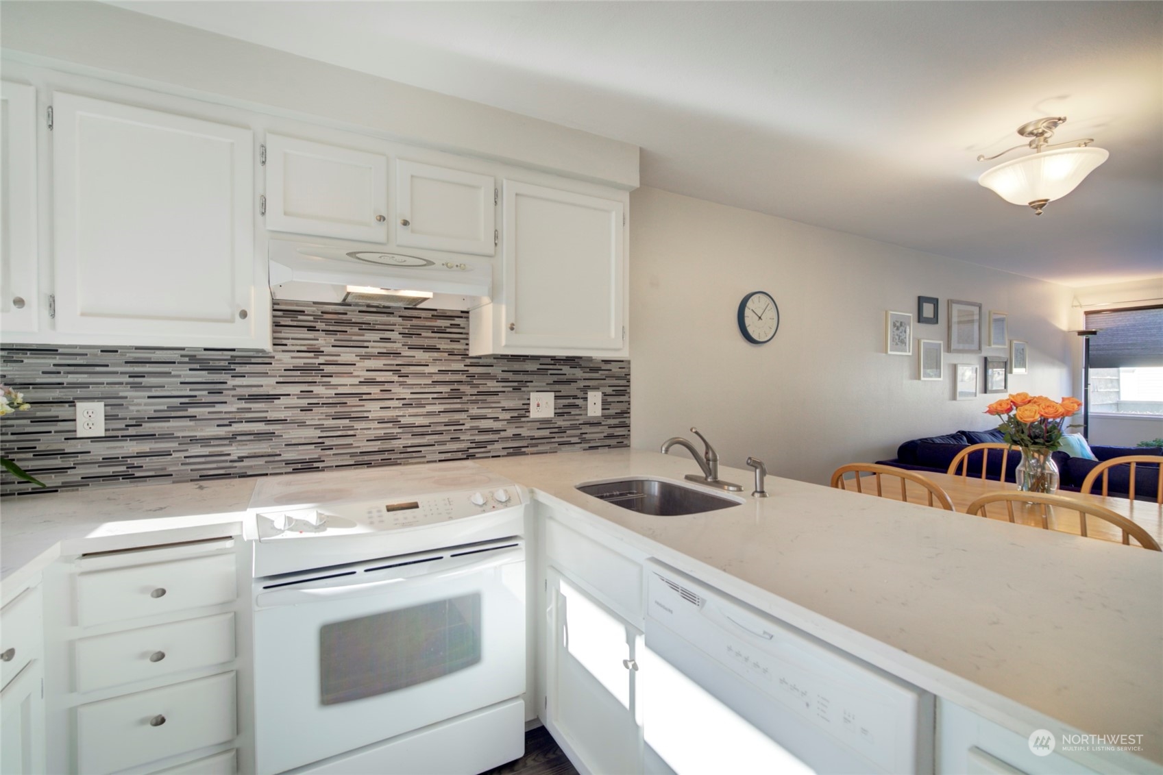 22906 Edmonds Way, Unit 15 Edmonds, WA 98020 - Photo 10 of 22 a kitchen with white cabinets and white appliances