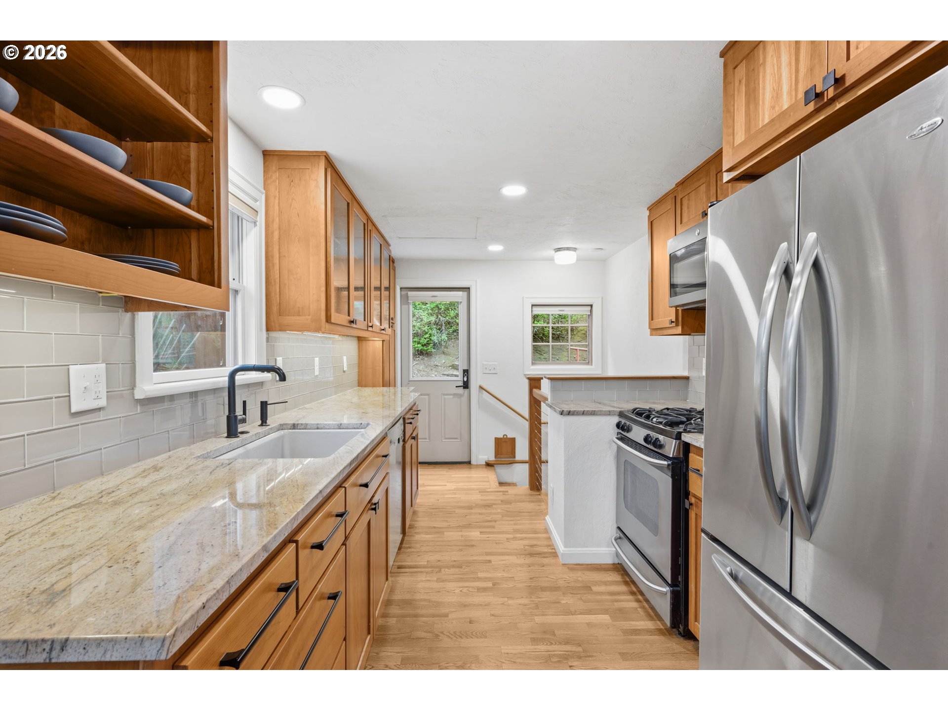 1841 Fairmount Boulevard Eugene, OR 97403 - Photo 13 of 44 a kitchen with stainless steel appliances granite countertop a refrigerator a sink and a stove