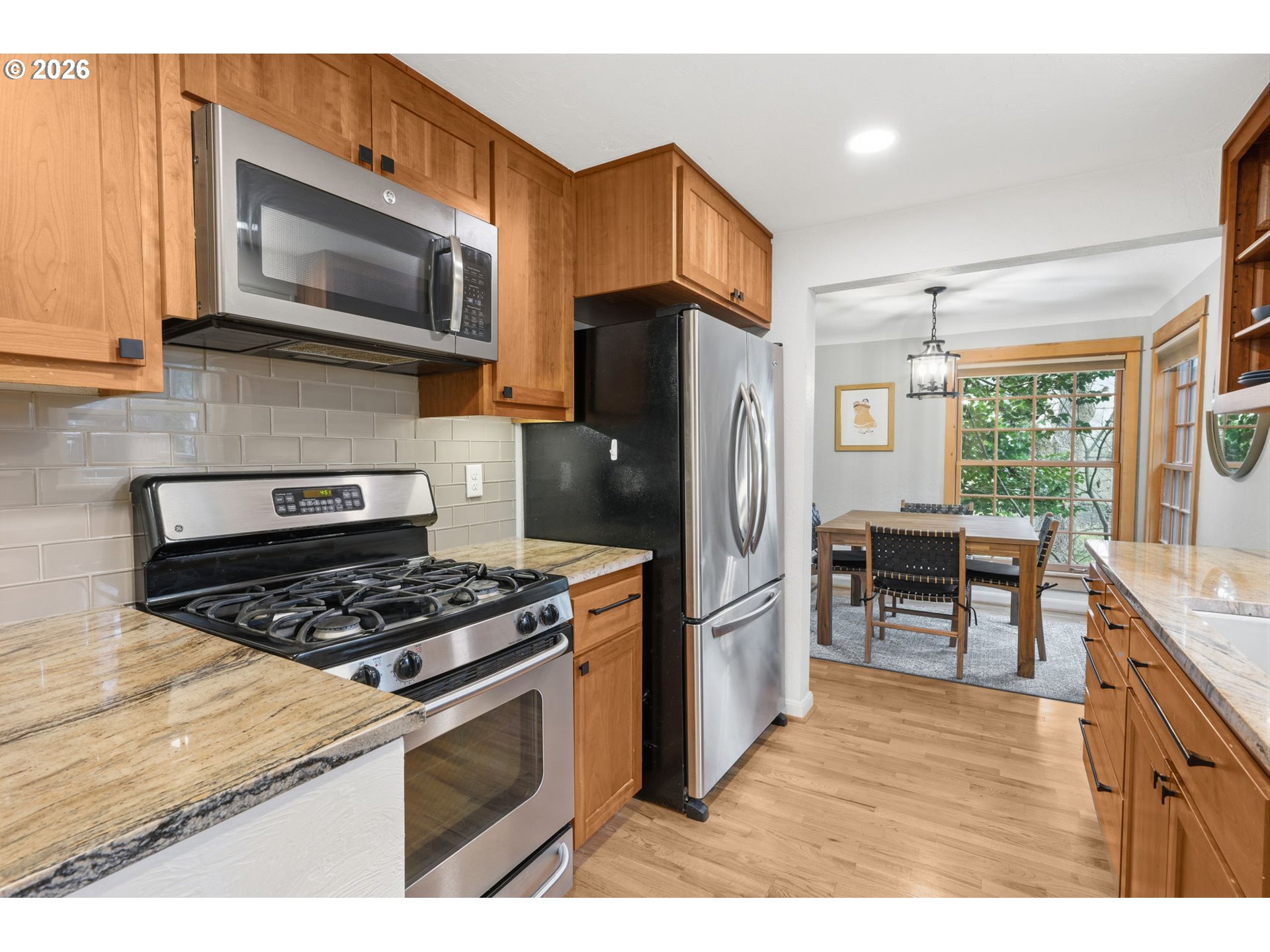 1841 Fairmount Boulevard Eugene, OR 97403 - Photo 16 of 44 a kitchen with stainless steel appliances granite countertop a refrigerator stove and microwave
