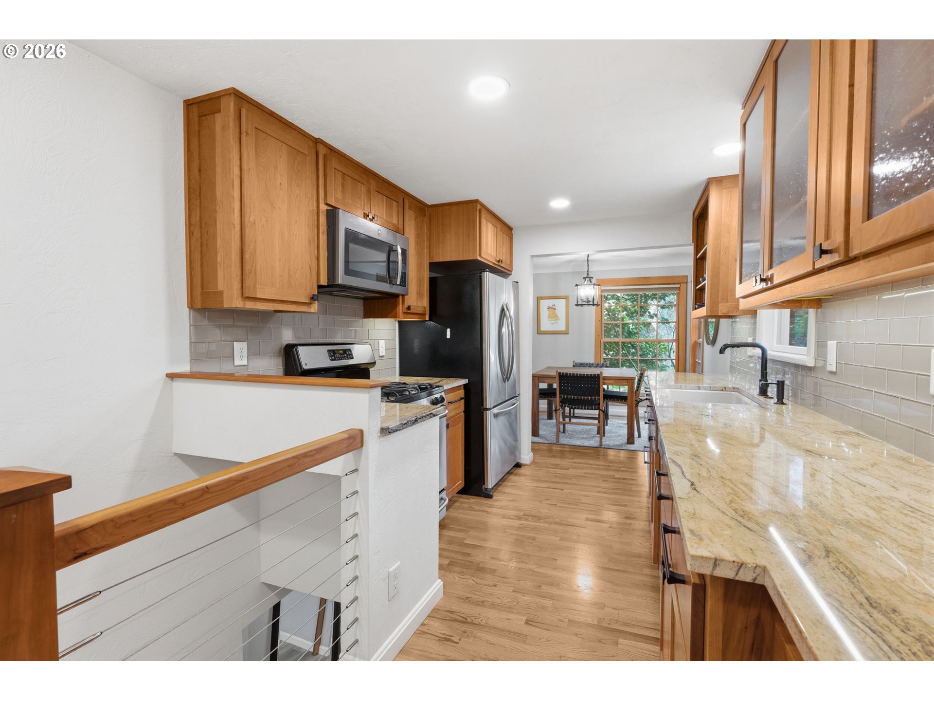 1841 Fairmount Boulevard Eugene, OR 97403 - Photo 17 of 44 a kitchen with stainless steel appliances granite countertop a refrigerator a stove and a wooden floors