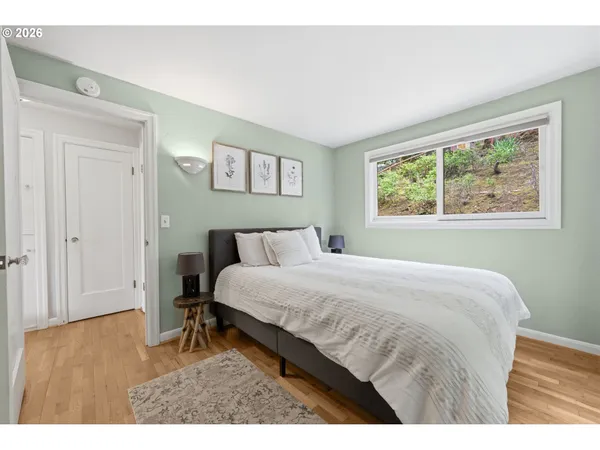 a bedroom with a bed and a table