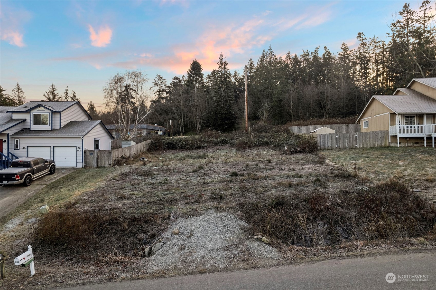 a view of a town with large trees