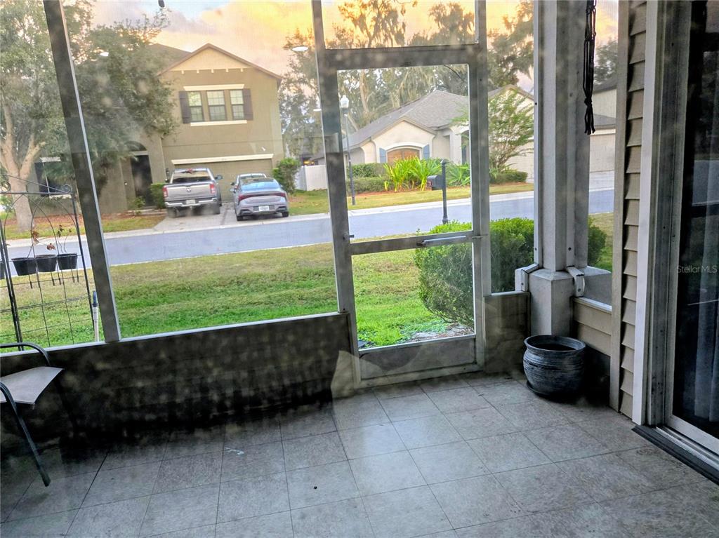5943 Topher Trail, Unit 22 Mulberry, FL 33860 - Photo 14 of 15 a view of a porch with furniture and garden