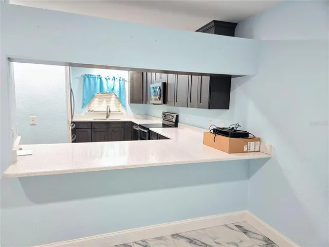 a view of kitchen with wooden floor