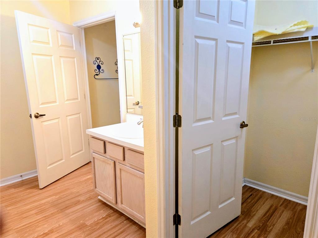 5943 Topher Trail, Unit 22 Mulberry, FL 33860 - Photo 8 of 15 a bathroom with a sink and a mirror