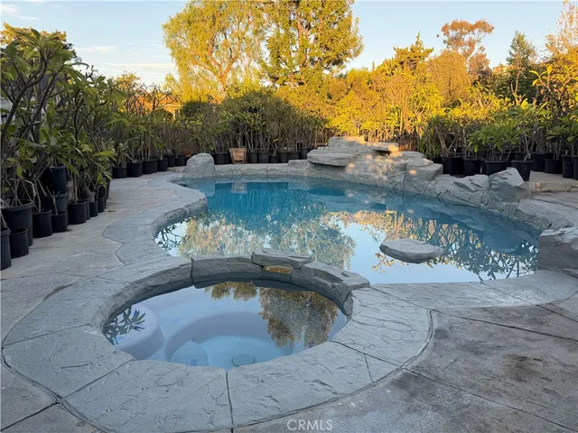 a view of a water fountain with a yard