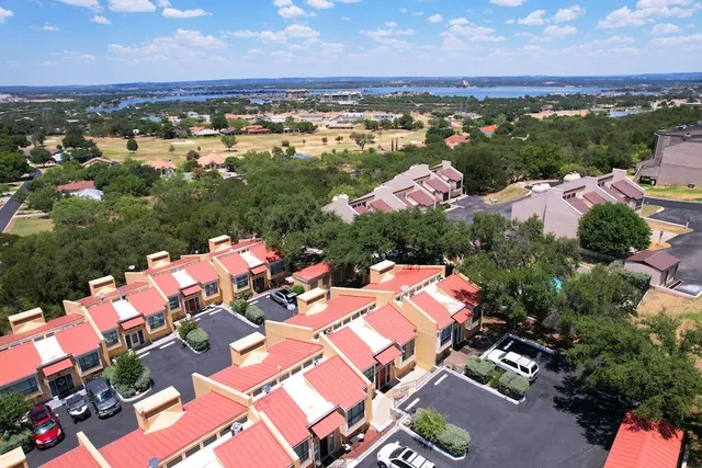 an aerial view of residential houses with outdoor space