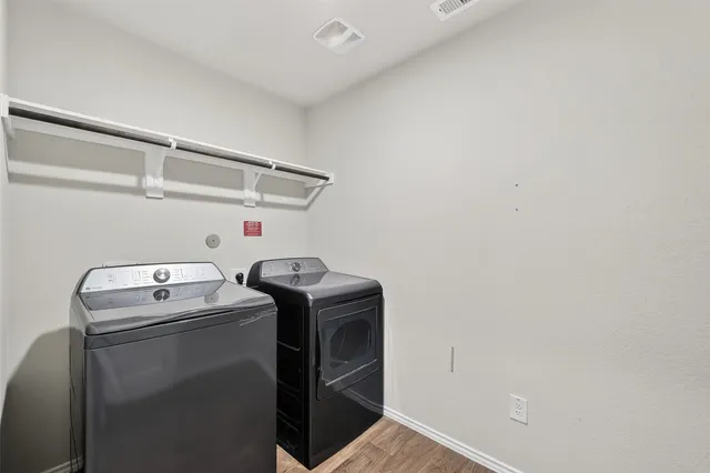 a utility room with dryer and washer