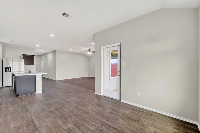 a view of kitchen with wooden floor