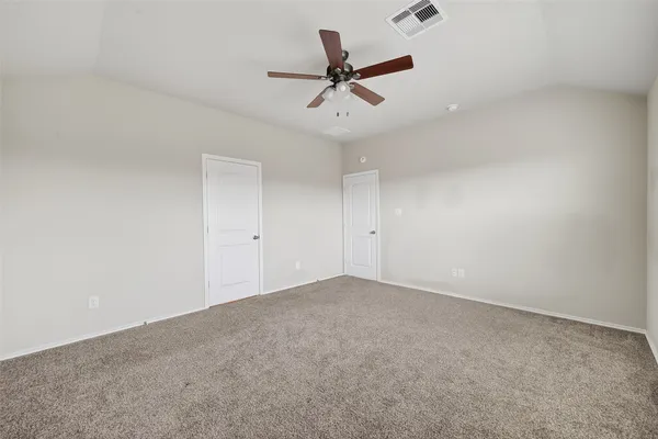 a bathroom with a glass door shower and tub