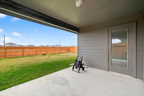 a front view of house with yard and outdoor seating