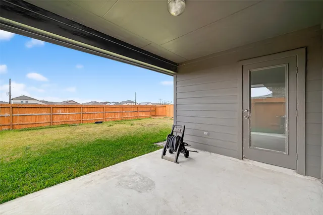 a front view of house with yard and outdoor seating