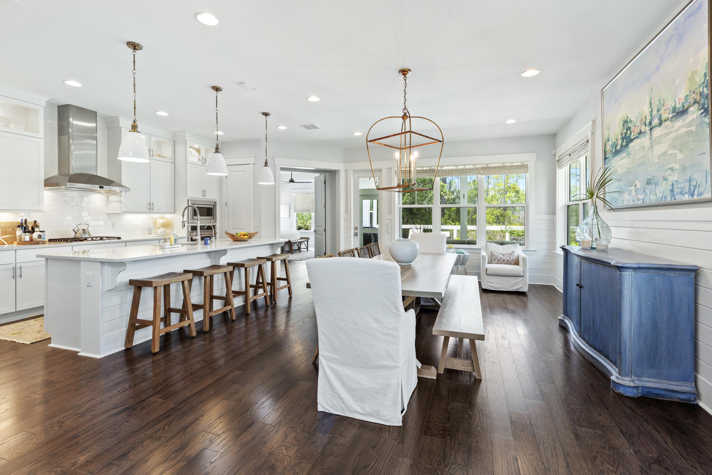 235 Prairie Pass Santa Rosa Beach, FL 32459 - Photo 14 of 80 a large kitchen with a table and chairs