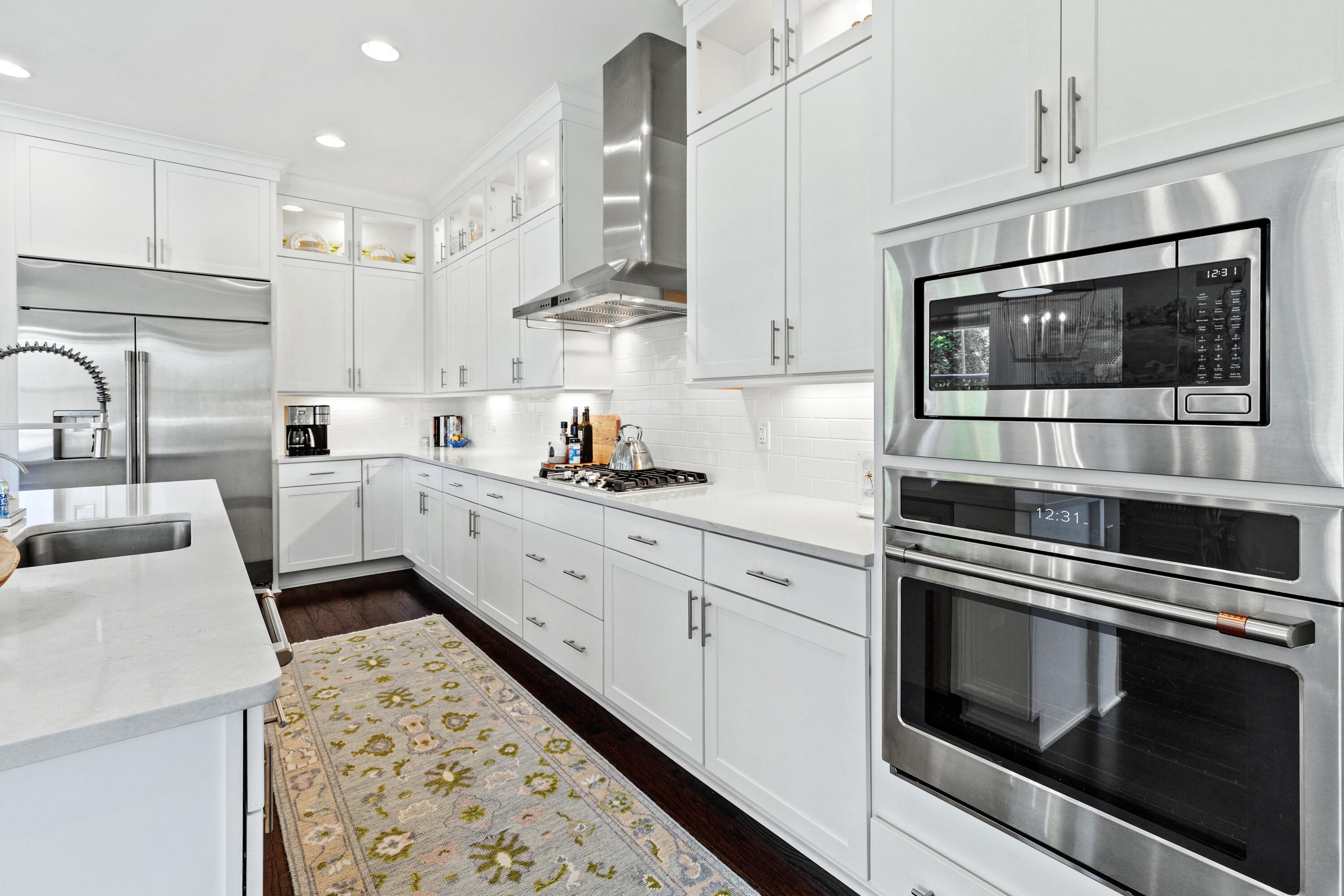 235 Prairie Pass Santa Rosa Beach, FL 32459 - Photo 18 of 80 a kitchen with stainless steel appliances kitchen island granite countertop a stove a sink and a microwave