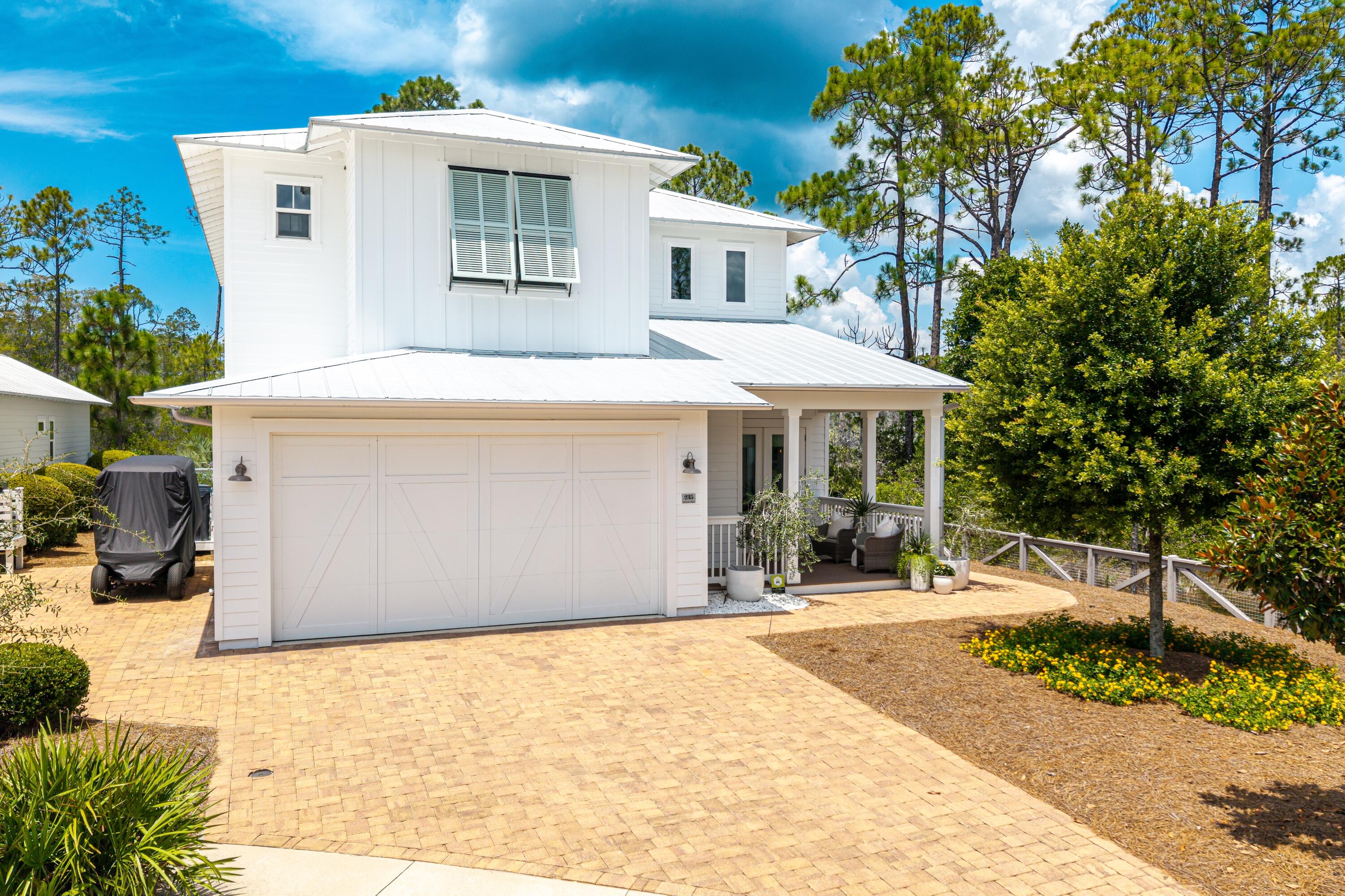 235 Prairie Pass Santa Rosa Beach, FL 32459 - Photo 2 of 80 a front view of a house with a yard
