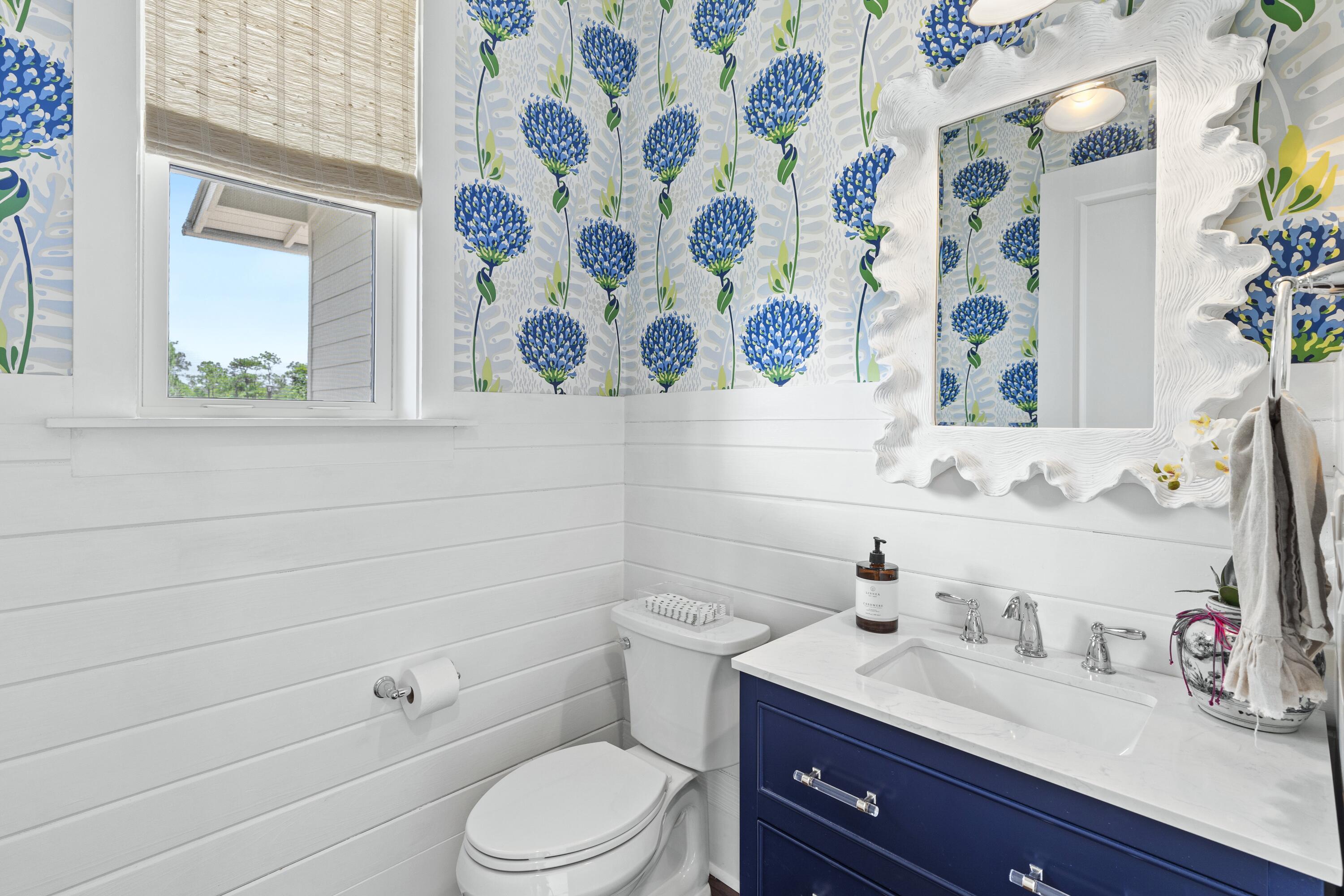 235 Prairie Pass Santa Rosa Beach, FL 32459 - Photo 25 of 80 a bathroom with a toilet sink and mirror