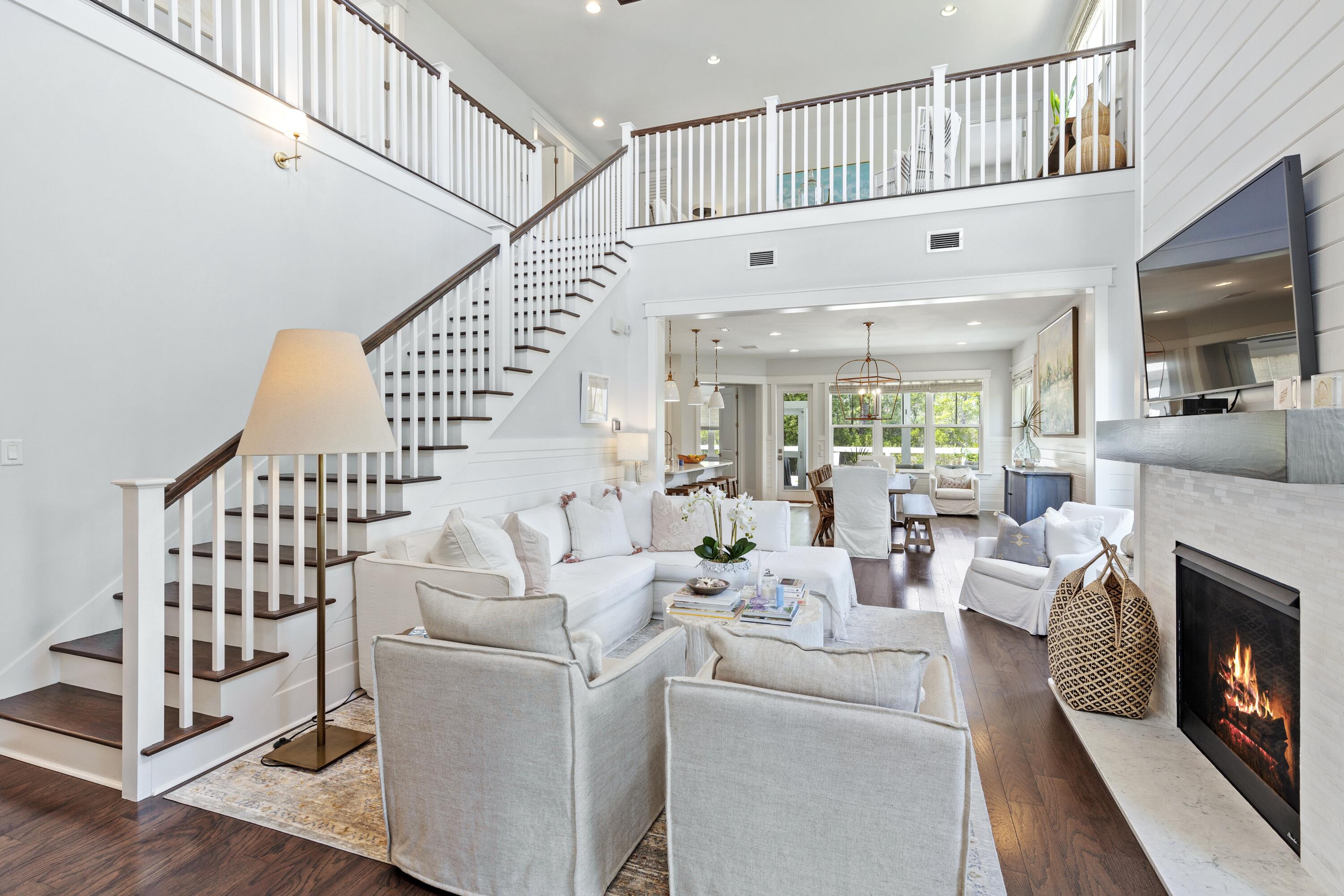 235 Prairie Pass Santa Rosa Beach, FL 32459 - Photo 3 of 80 a living room with fireplace furniture and a large window