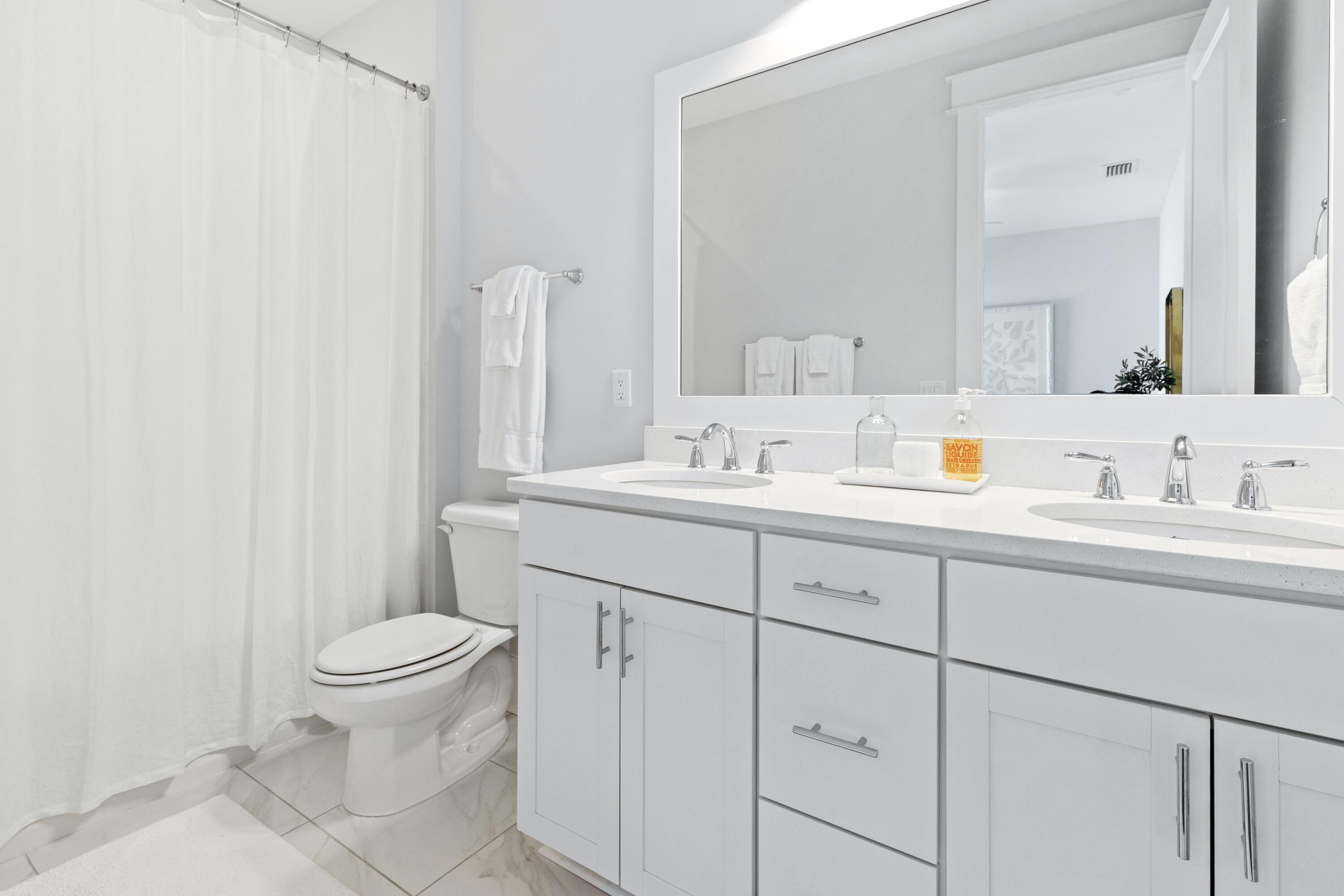 235 Prairie Pass Santa Rosa Beach, FL 32459 - Photo 35 of 80 a bathroom with a sink toilet and mirror