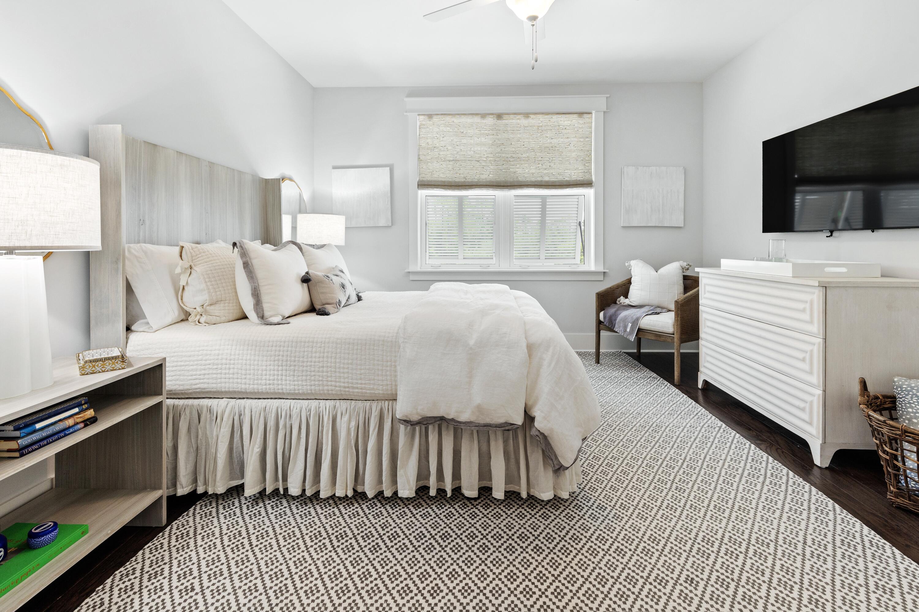 235 Prairie Pass Santa Rosa Beach, FL 32459 - Photo 36 of 80 a bedroom with a bed and a flat tv screen