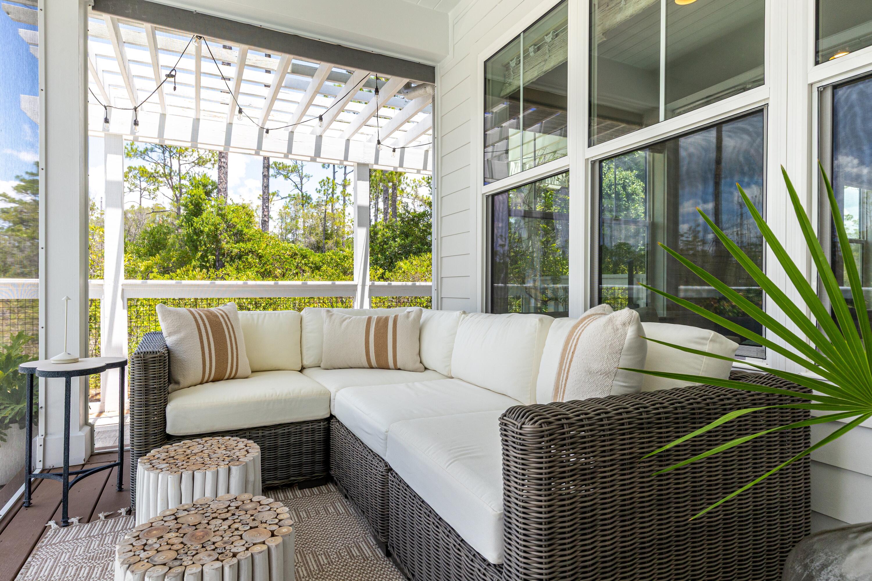 235 Prairie Pass Santa Rosa Beach, FL 32459 - Photo 43 of 80 a living room with furniture a large window and outer view