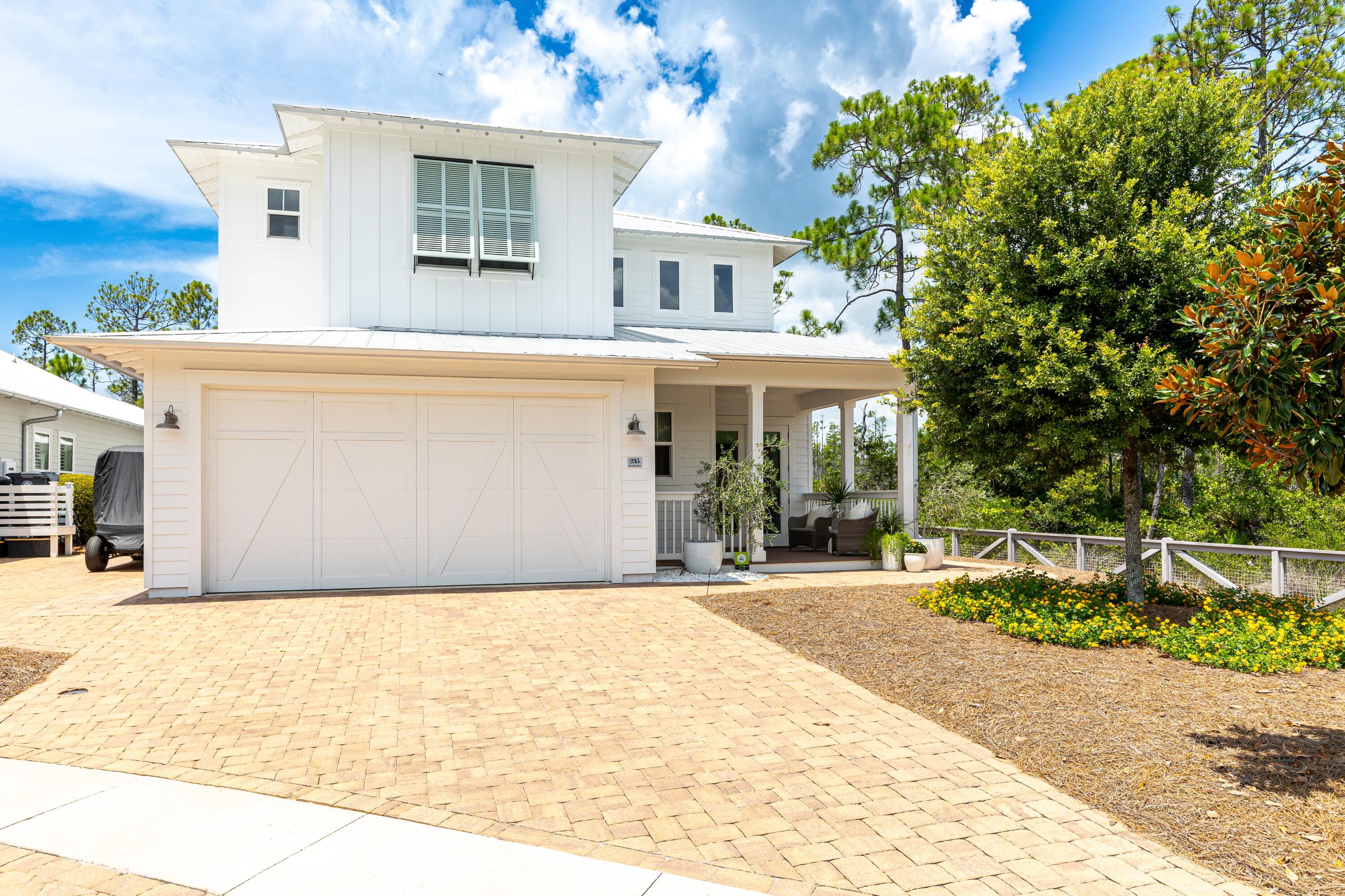 235 Prairie Pass Santa Rosa Beach, FL 32459 - Photo 55 of 80 a front view of a house with yard and tress