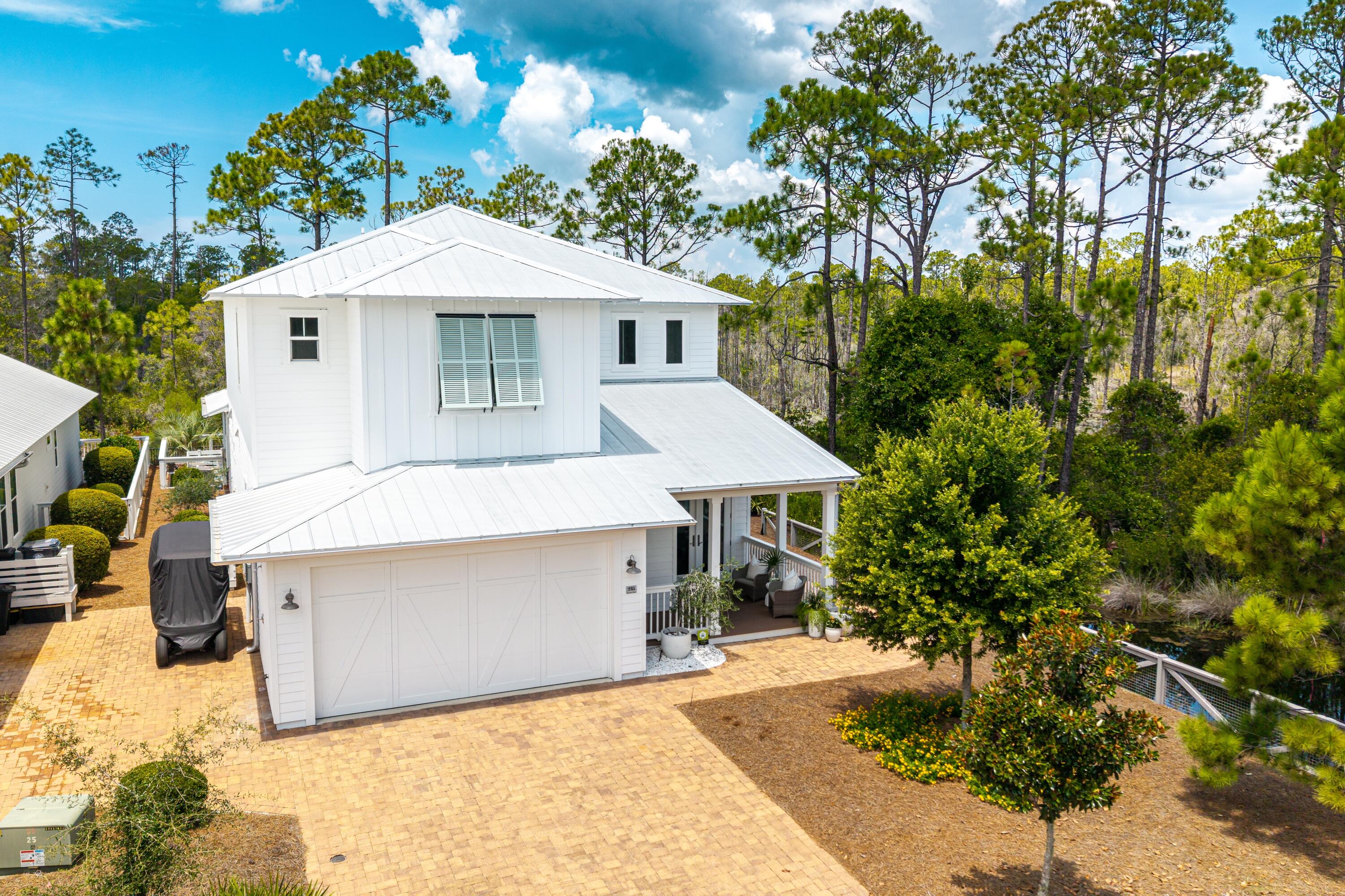 235 Prairie Pass Santa Rosa Beach, FL 32459 - Photo 56 of 80 a front view of a house with a yard