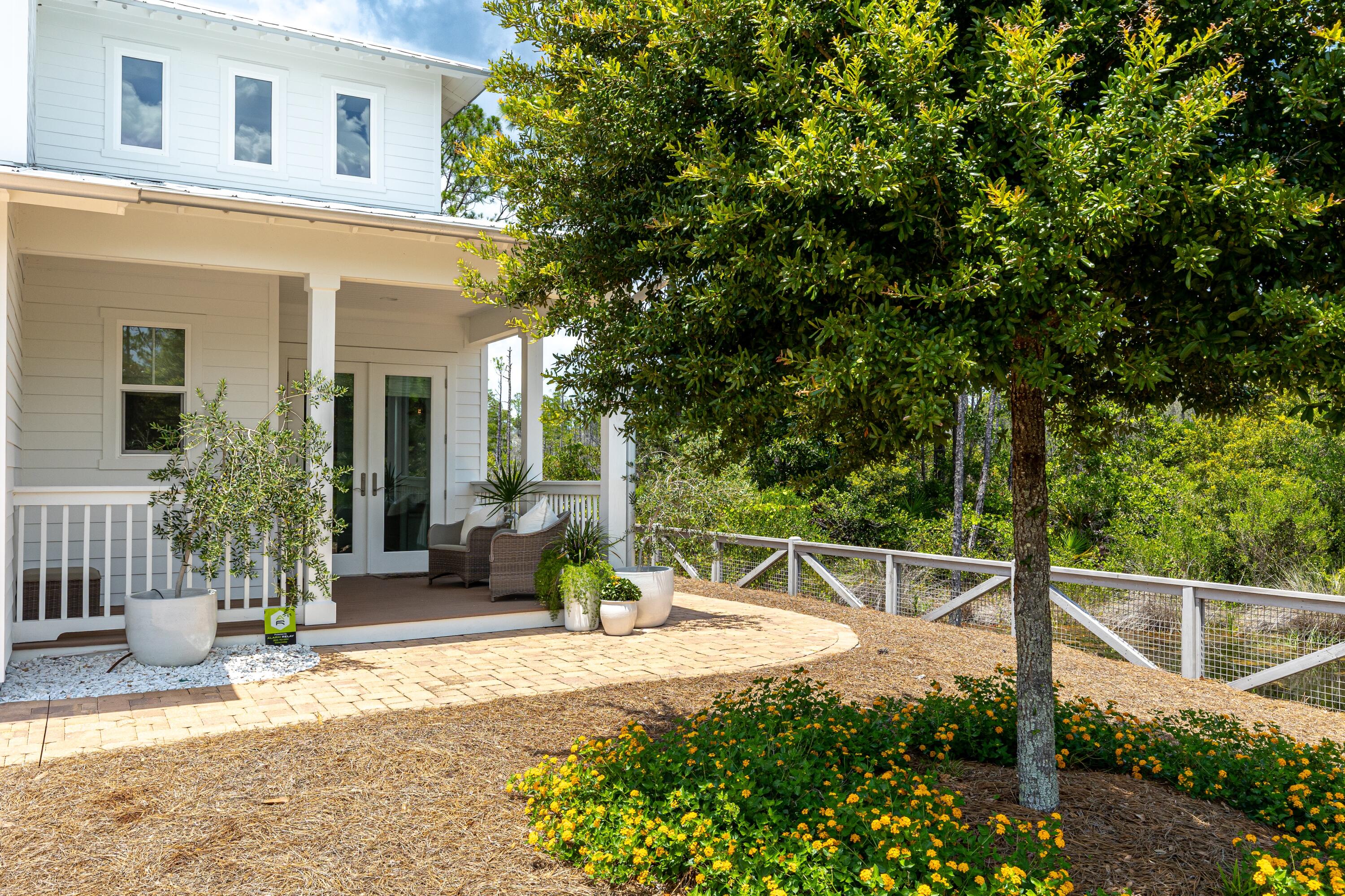 235 Prairie Pass Santa Rosa Beach, FL 32459 - Photo 61 of 80 a view of a backyard with a patio