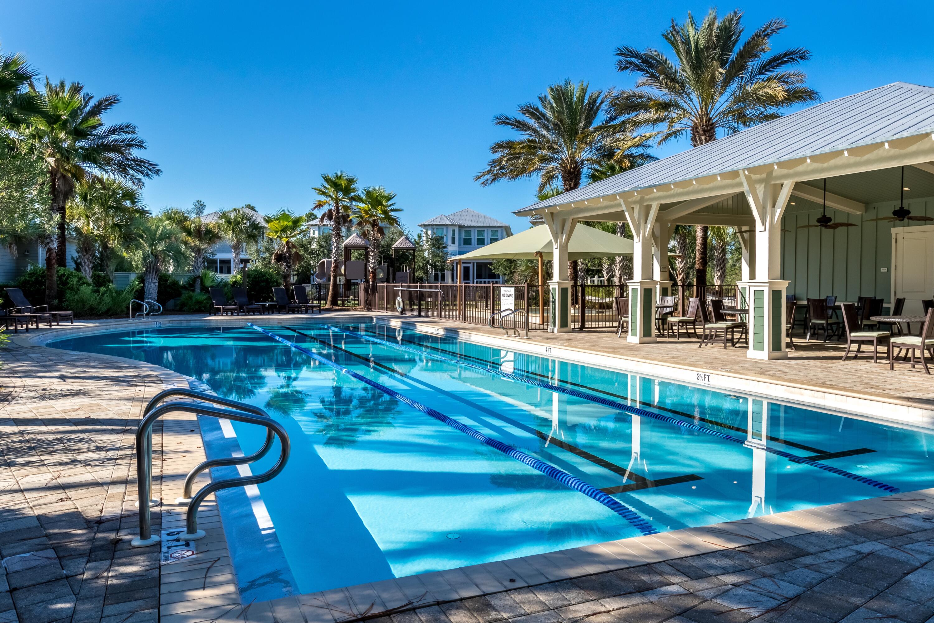 235 Prairie Pass Santa Rosa Beach, FL 32459 - Photo 66 of 80 a view of a house with backyard and swimming pool