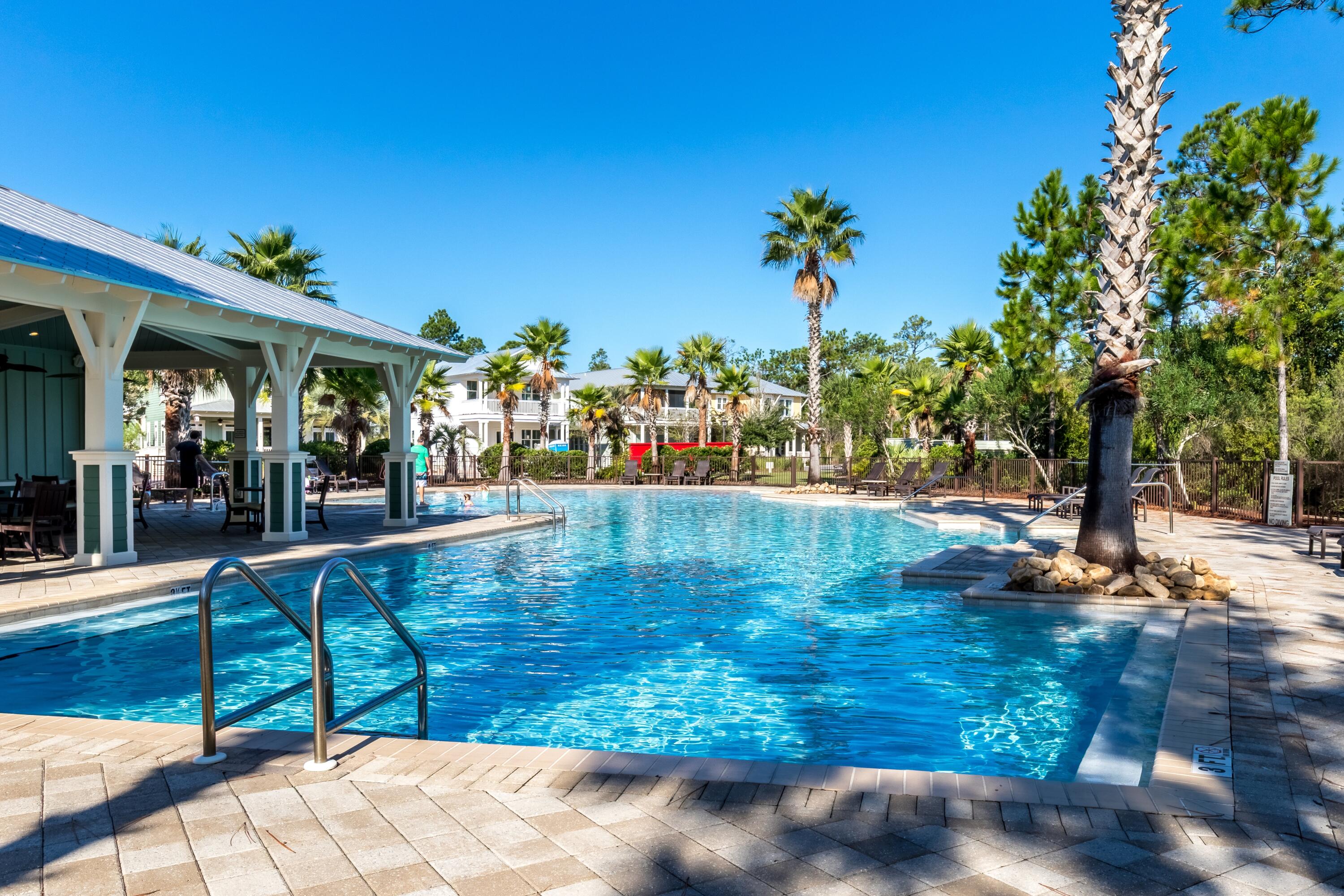 235 Prairie Pass Santa Rosa Beach, FL 32459 - Photo 69 of 80 a view of a swimming pool with an outdoor seating