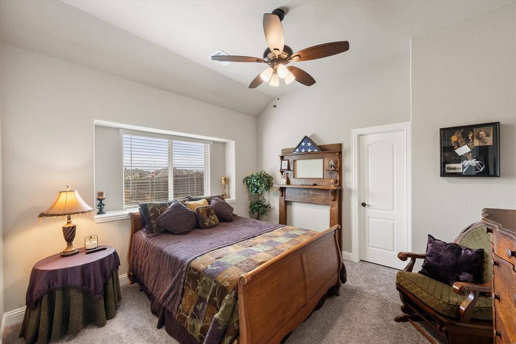445 Rusty Run Drive Midlothian, TX 76065 - Photo 28 of 40 a bedroom with a bed couch and a window