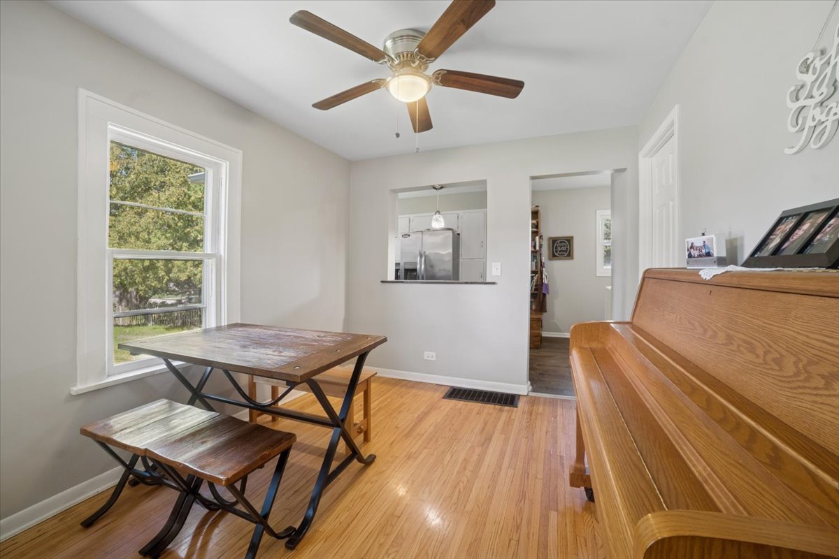 508 River Bluff Road Elgin, IL 60120 - Photo 5 of 17 a living room with furniture and a wooden floor