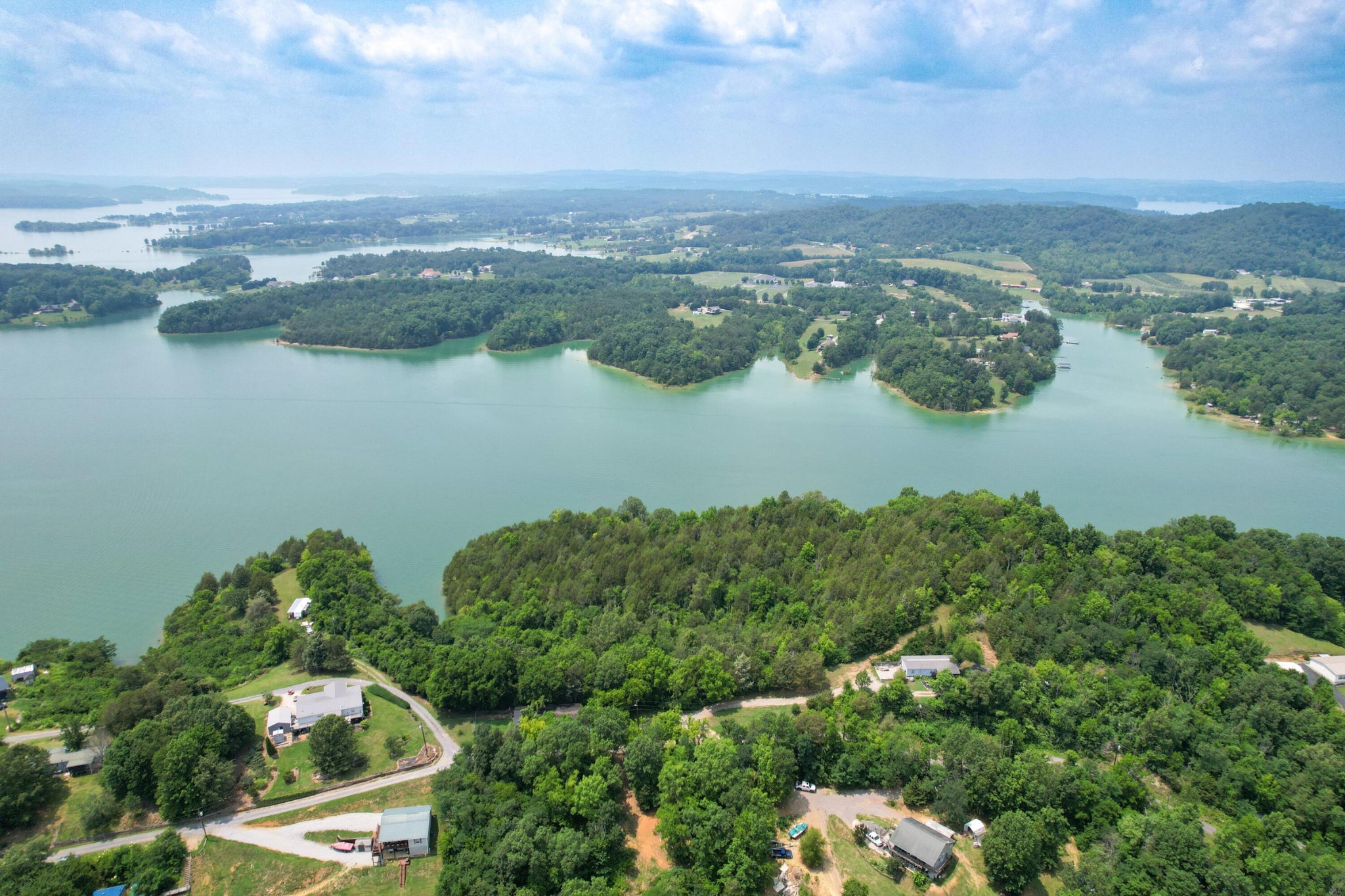2751 Von Hill Road Dandridge, TN 37725 - Photo 23 of 29 an aerial view of green landscape with trees houses and lake view