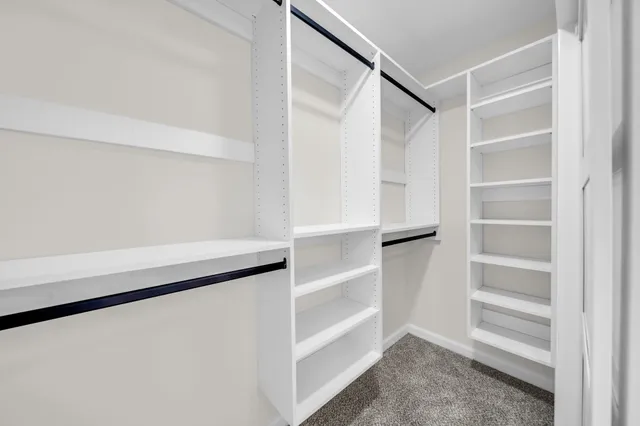 a bathroom with a sink and mirror with toilet