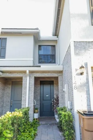 front view of a house with a small yard