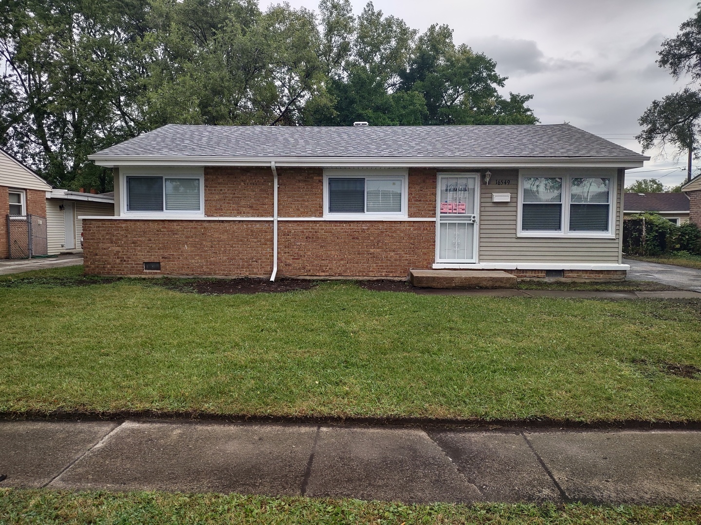 16549 California Avenue Markham, IL 60428 - Photo 1 of 14 a front view of a house with a garden