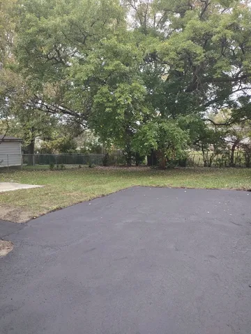 a view of a field with an outdoor space